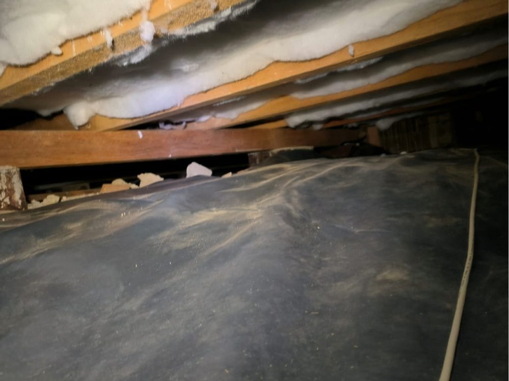 Underfloor insulation installed with ground moisture barrier